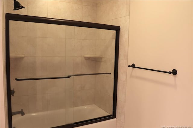 bathroom featuring enclosed tub / shower combo