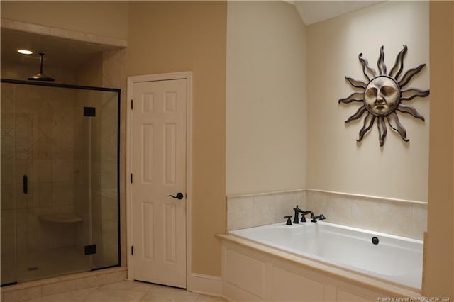 bathroom with tile patterned floors and separate shower and tub