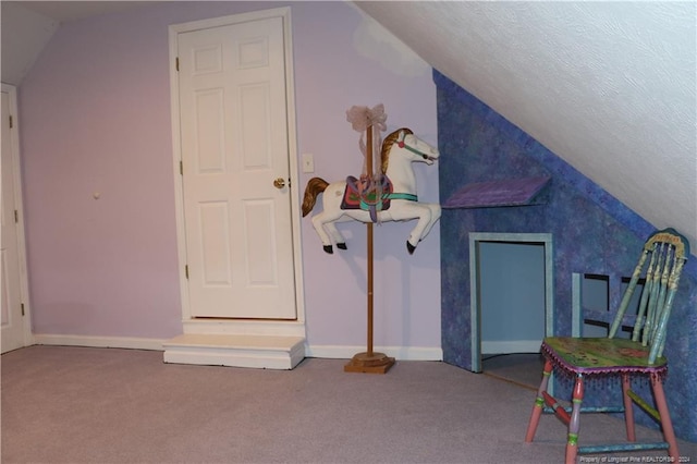 additional living space with carpet flooring and vaulted ceiling