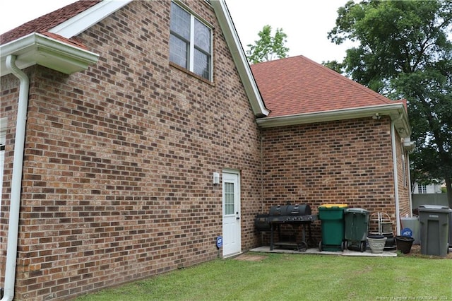 exterior space featuring a lawn and a patio