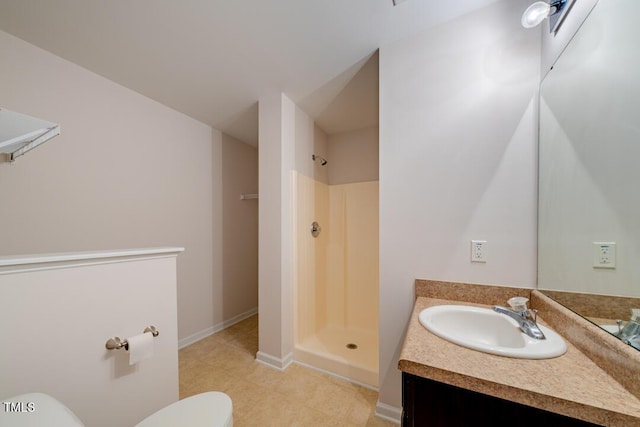 bathroom featuring vanity, toilet, and walk in shower