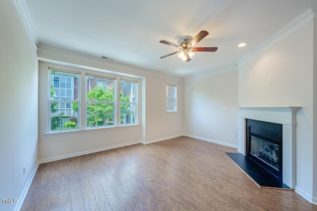 unfurnished living room featuring hardwood / wood-style flooring, ornamental molding, and ceiling fan