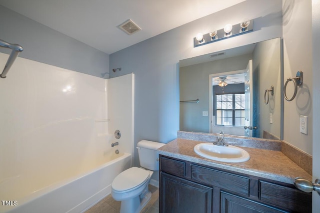 full bathroom featuring vanity, ceiling fan, shower / washtub combination, and toilet