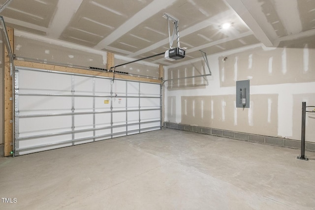 garage with a garage door opener and electric panel