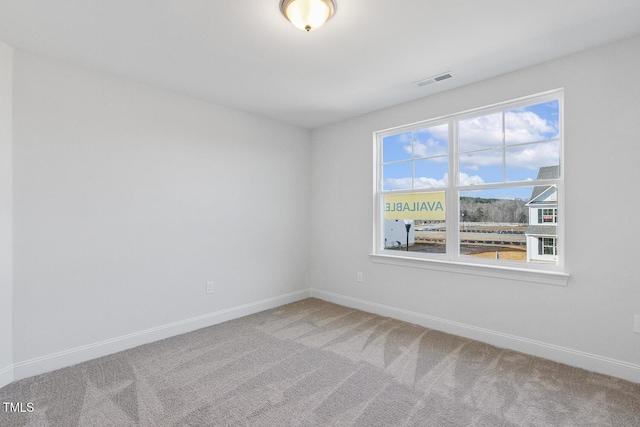 spare room featuring carpet floors