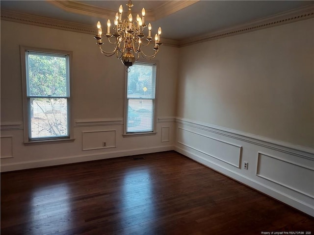 empty room featuring dark hardwood / wood-style flooring and a notable chandelier