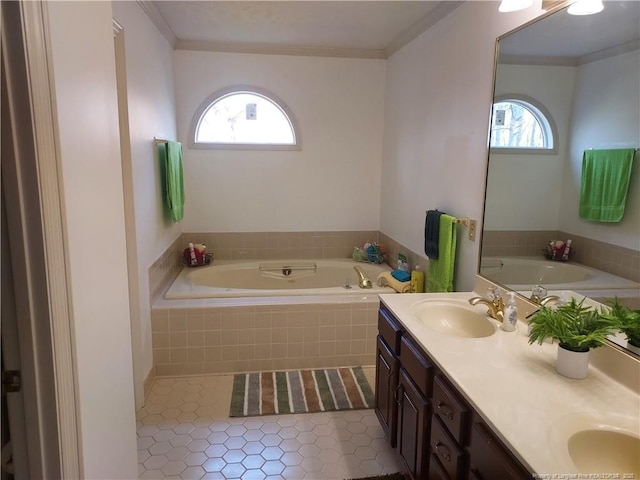 bathroom featuring ornamental molding, a relaxing tiled tub, tile patterned floors, and vanity