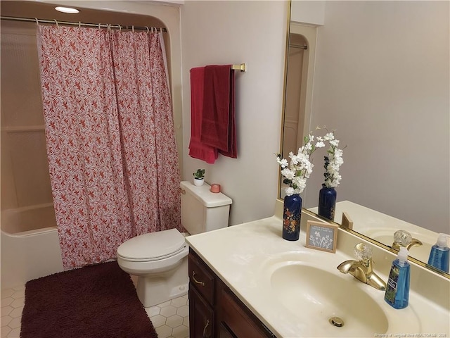 full bathroom with shower / tub combo, tile patterned flooring, vanity, and toilet