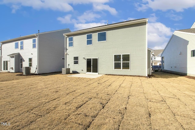 back of house with a patio area and central AC unit