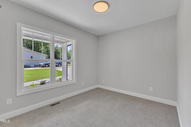 empty room featuring carpet flooring