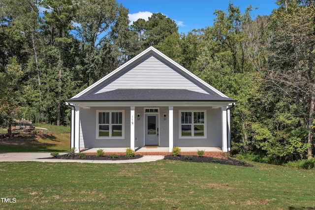 view of front of property with a front lawn and covered porch