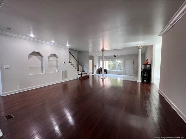 unfurnished living room featuring ornamental molding and dark hardwood / wood-style floors