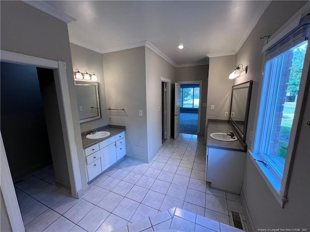 bathroom with vanity, crown molding, and tile patterned floors