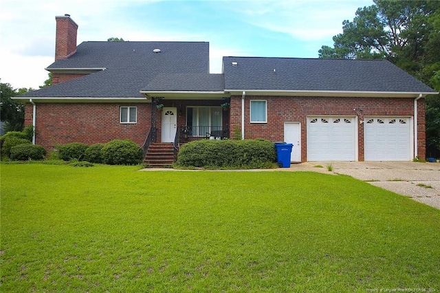 view of front of property featuring a front lawn and a garage