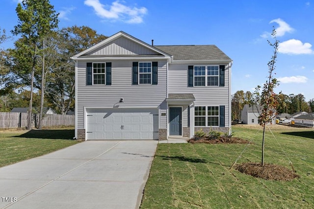 view of front of home featuring a garage and a front lawn