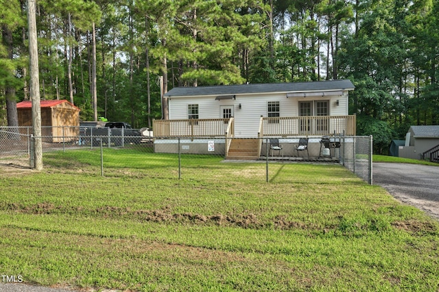 exterior space featuring a front yard and a deck