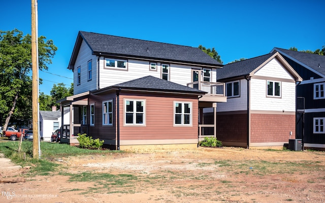 rear view of property featuring central air condition unit