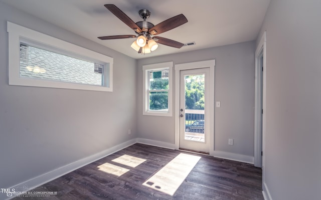 unfurnished room featuring dark hardwood / wood-style flooring and ceiling fan