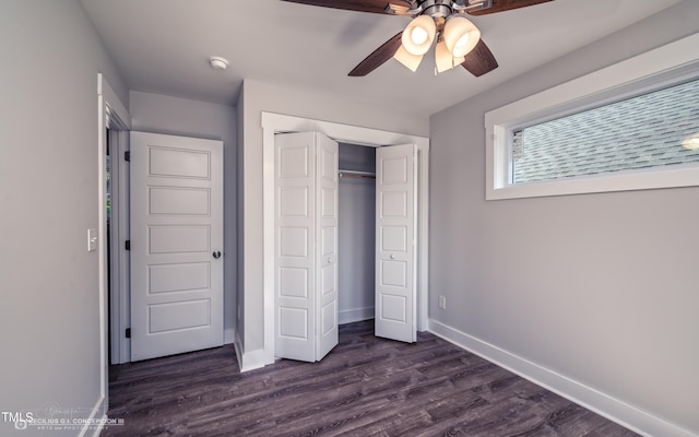 unfurnished bedroom with a closet, dark wood-type flooring, and ceiling fan