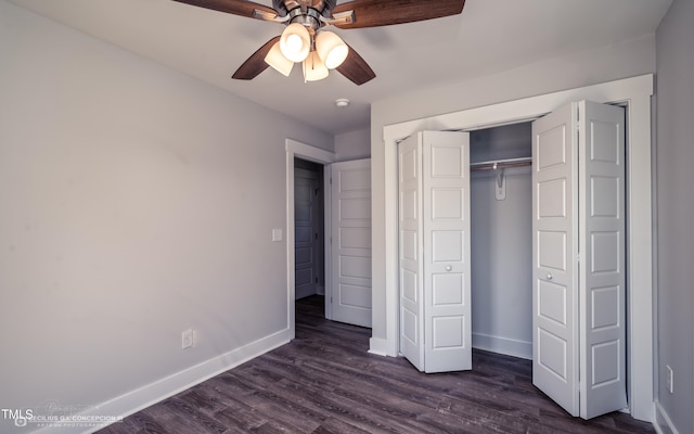 unfurnished bedroom featuring ceiling fan, dark wood-type flooring, and a closet