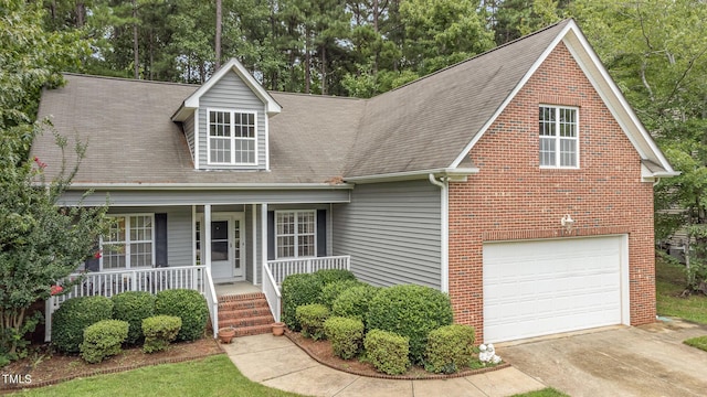 view of front of property with a garage and covered porch