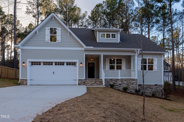 craftsman-style home featuring a porch and a garage