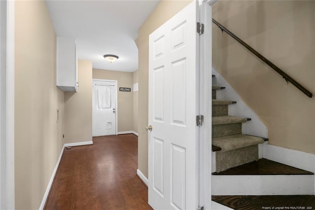 stairway with hardwood / wood-style flooring