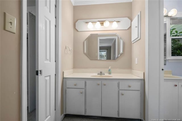 bathroom featuring vanity and crown molding