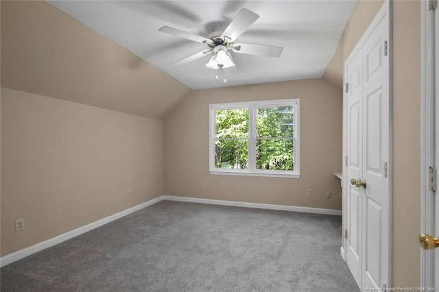 bonus room with ceiling fan, lofted ceiling, and light carpet