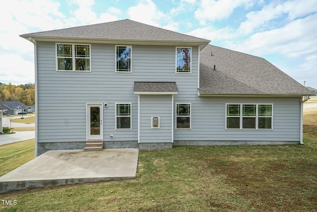 rear view of property with a patio area and a lawn