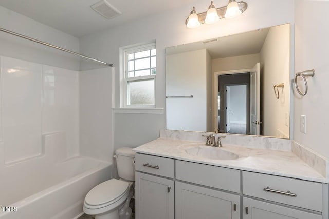 full bathroom with washtub / shower combination, vanity, and toilet