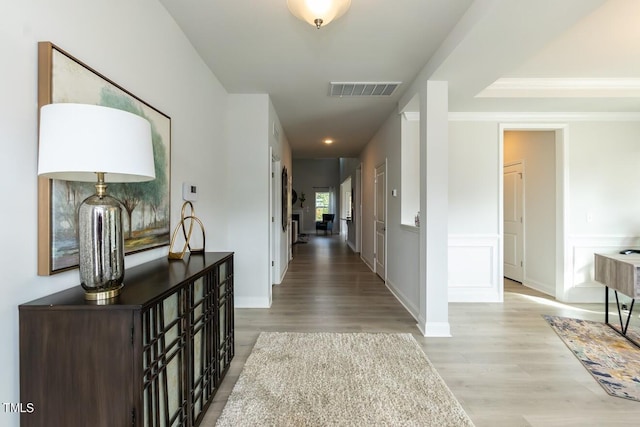 corridor featuring light hardwood / wood-style floors