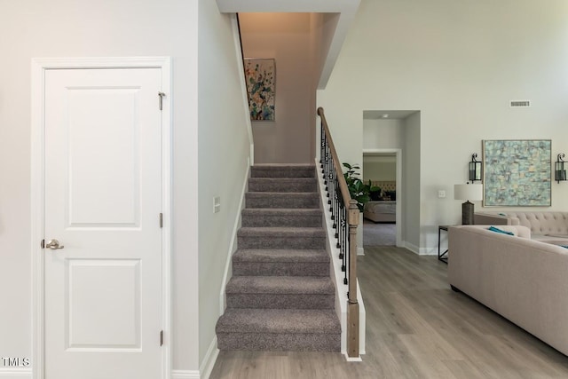 stairway with hardwood / wood-style flooring