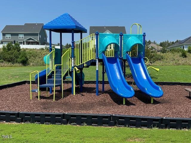 view of playground with a yard