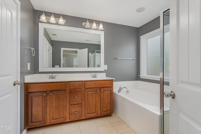 bathroom featuring tile patterned floors, separate shower and tub, and vanity