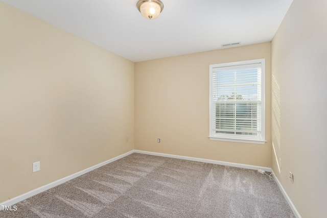 spare room featuring carpet flooring