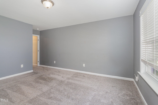 empty room featuring carpet flooring