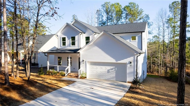 view of front of house with a porch and a garage