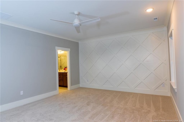 spare room featuring light carpet, ceiling fan, and ornamental molding