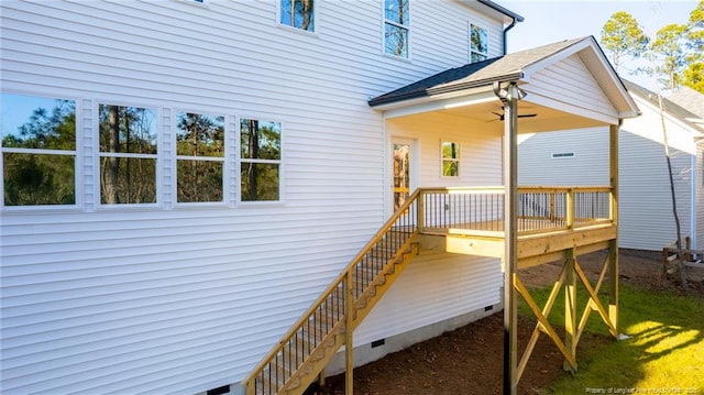 exterior space featuring ceiling fan and a deck