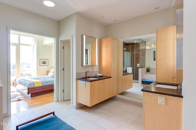 bathroom with tile patterned floors and sink