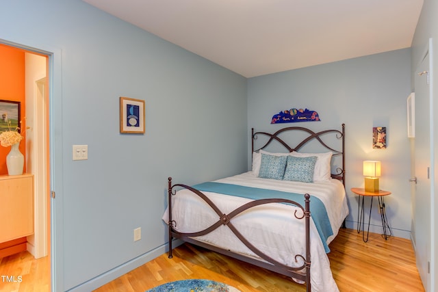 bedroom with hardwood / wood-style flooring