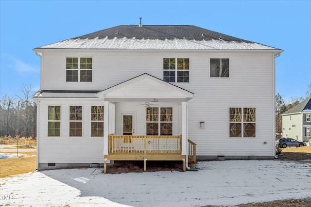 snow covered back of property with a ceiling fan, crawl space, roof with shingles, and a deck