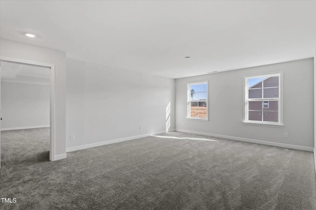 unfurnished room featuring recessed lighting, carpet flooring, and baseboards