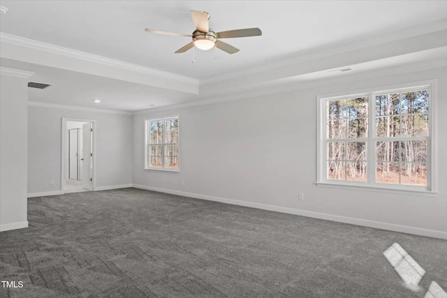 unfurnished room with baseboards, visible vents, a ceiling fan, ornamental molding, and dark carpet