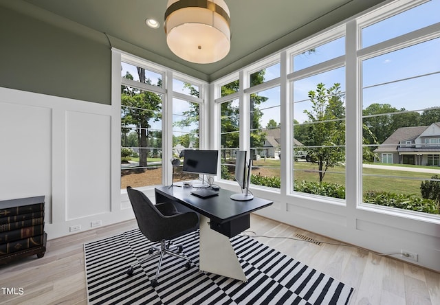 sunroom / solarium featuring plenty of natural light