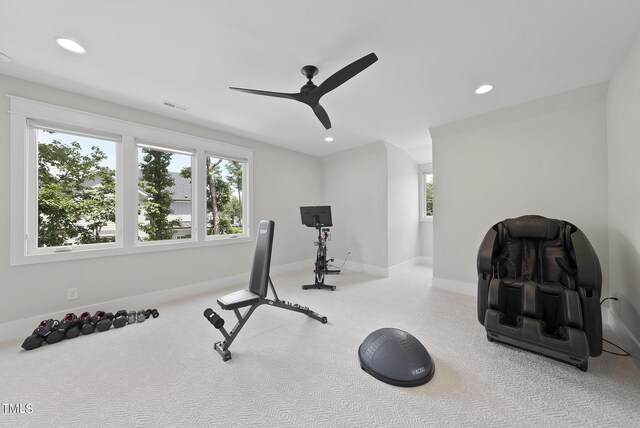 exercise room with ceiling fan