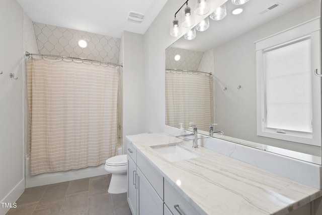 full bathroom with shower / tub combo with curtain, vanity, toilet, and tile patterned flooring