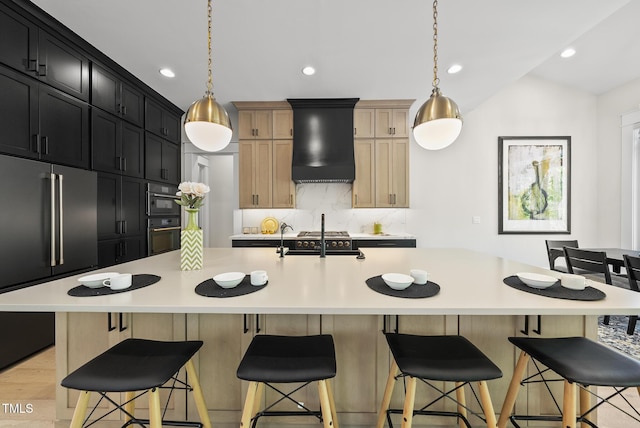 kitchen with custom exhaust hood, high end fridge, tasteful backsplash, oven, and light countertops