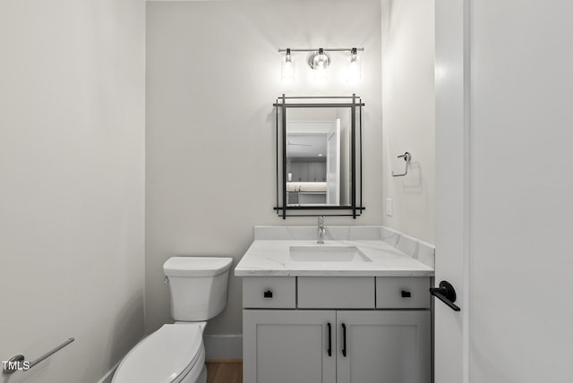 bathroom with toilet and vanity